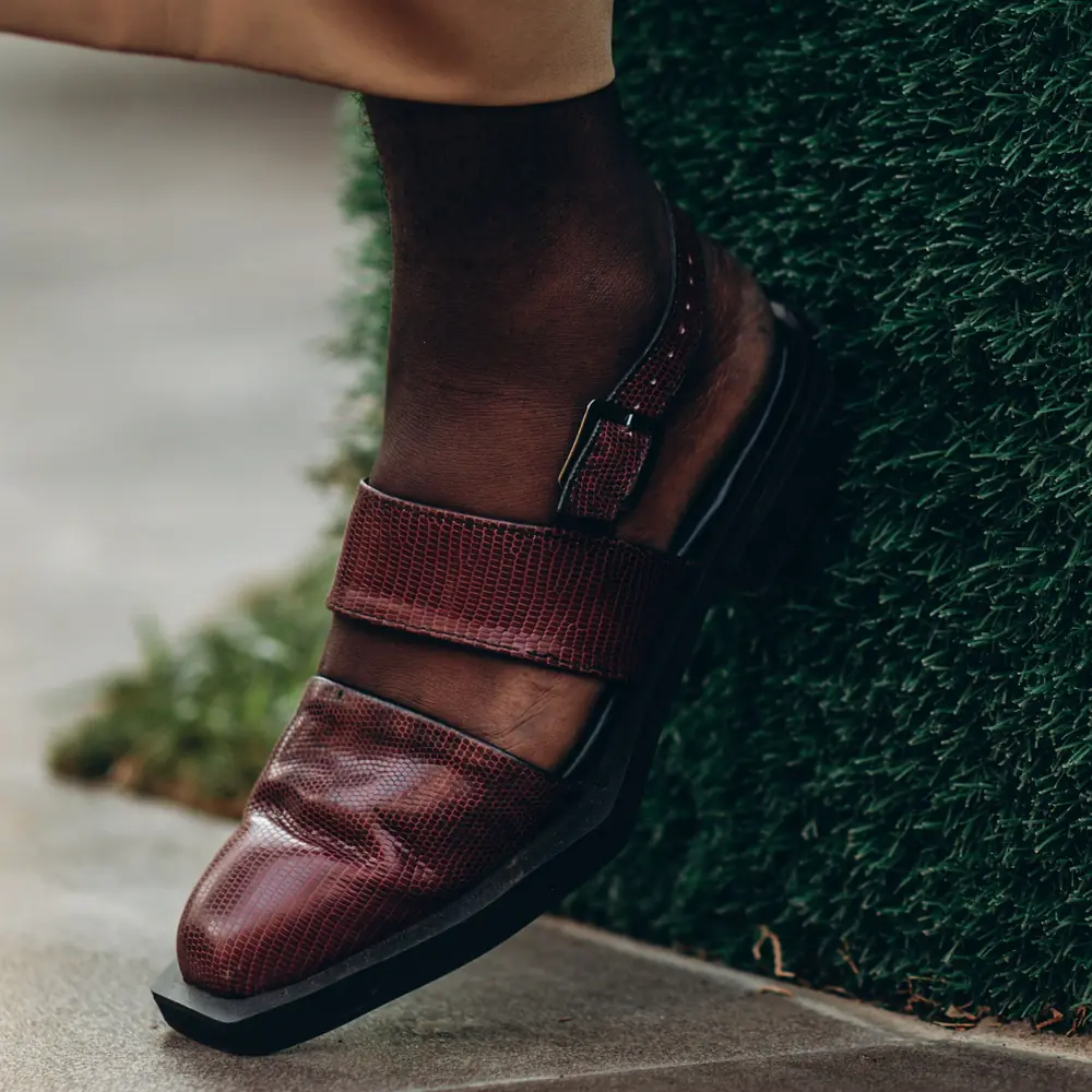Side view of a maroon Peshawari chappal