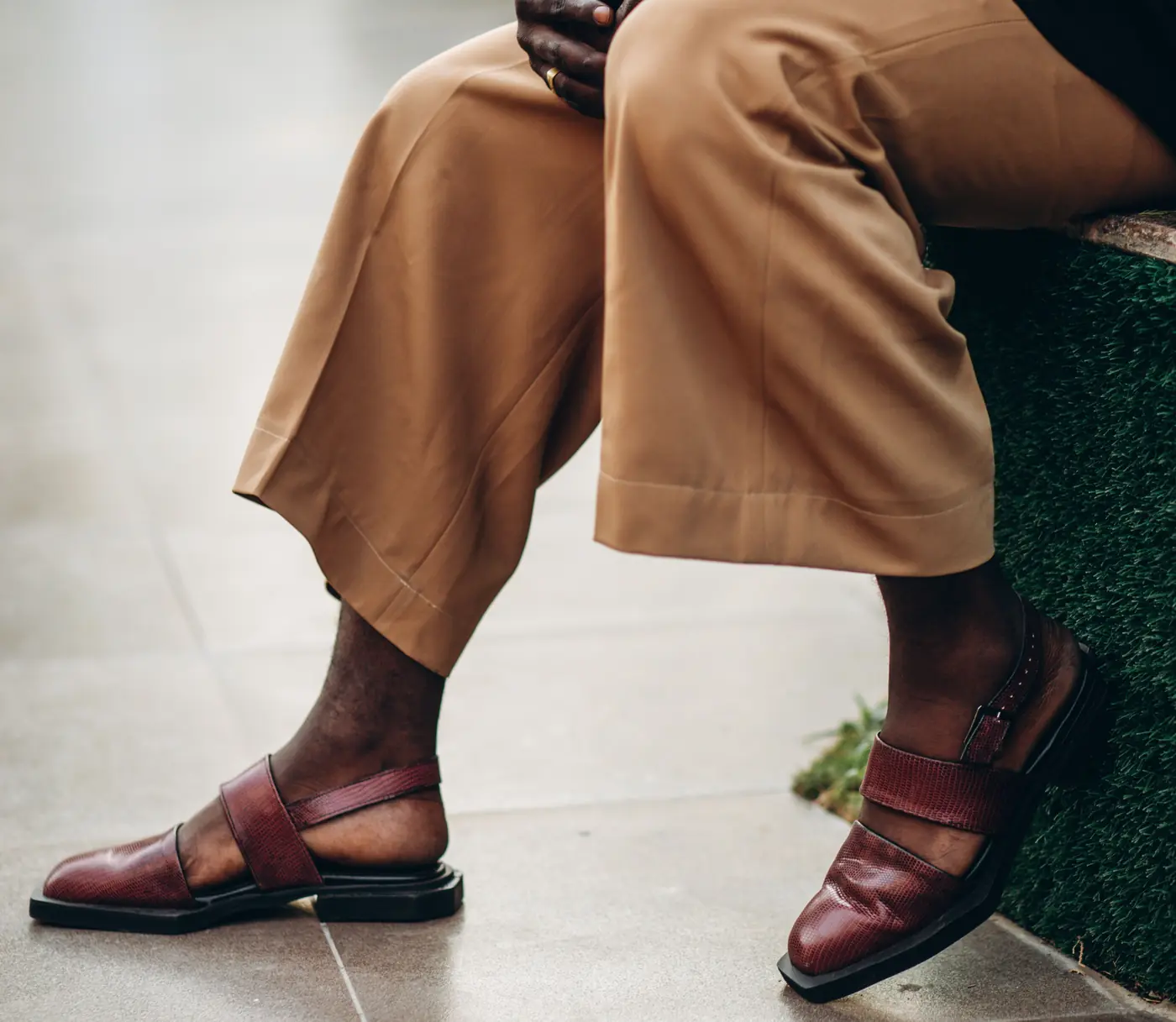 A pair of maroon Peshawari chappals worn with a beige shalwar