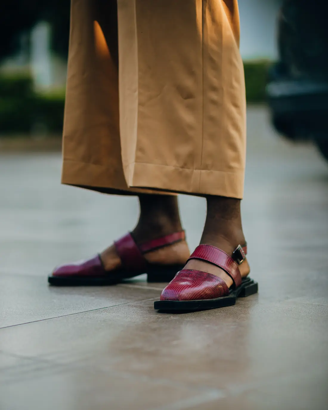 Standing tall in maroon Peshawari chappals